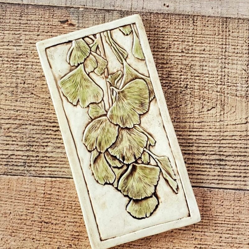 4x8 tile of a graceful branch of ginkgo leaves.
