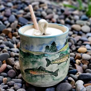 Hand built ceramic honey pot decorated with swimming trout. 