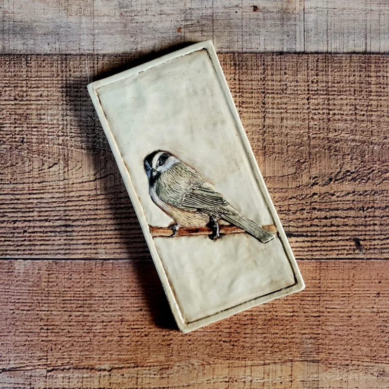 4x8 inch ceramic tile of a mountain chickadee sitting on a branch