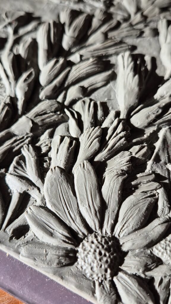 Close up of carving detail of Meadow Bloom 8x 12 Tile