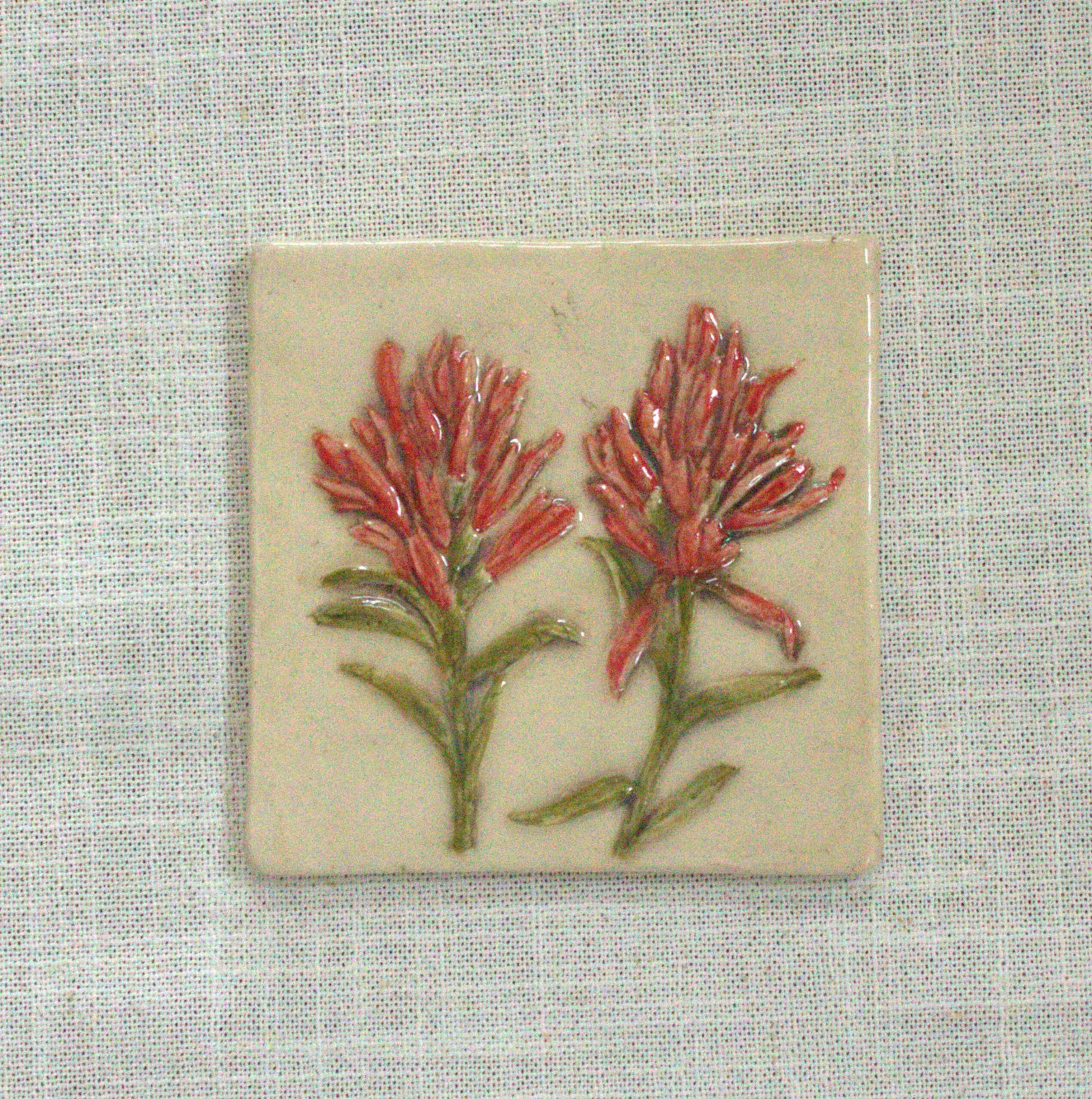 Hand-painted 4 inch Indian Paintbrush ceramic accent tile from the Meadow Bloom collection by Fire Creek Clay.