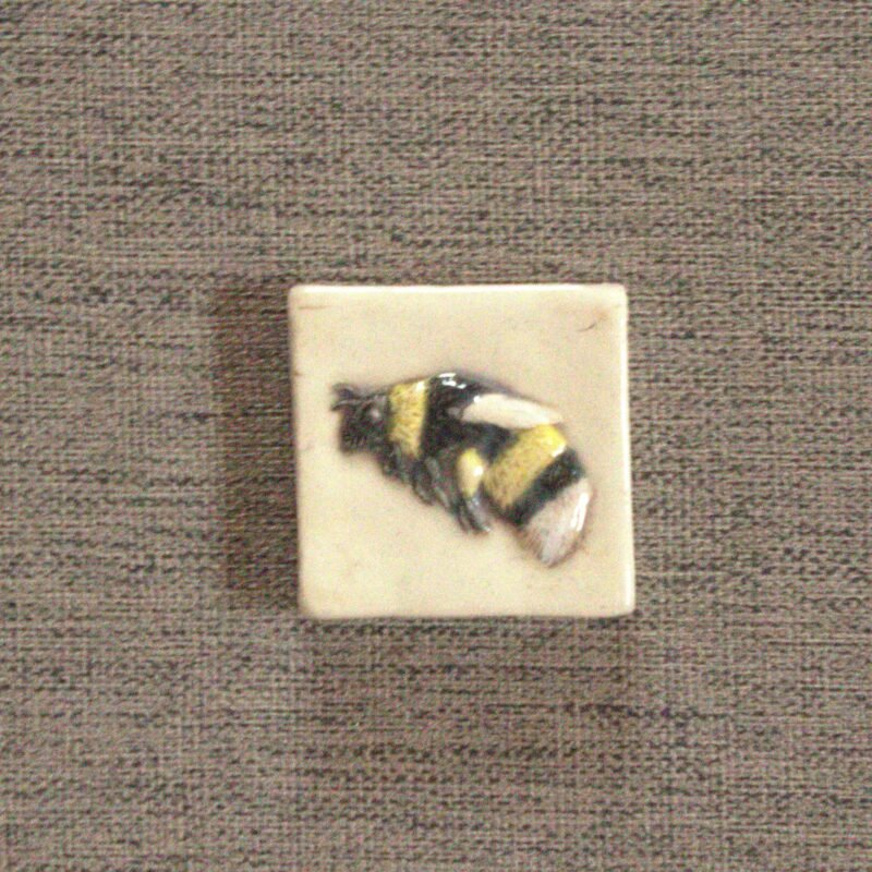 hand carved bumble bee 2 inch tile hand painted in black, yellow and white