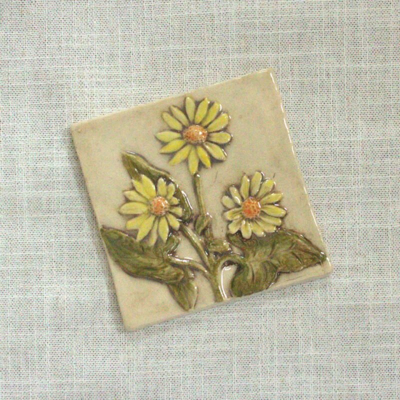 4 inch hand carved and hand painted ceramic tile of a grouping of yellow flowered Balsamroot Flowers