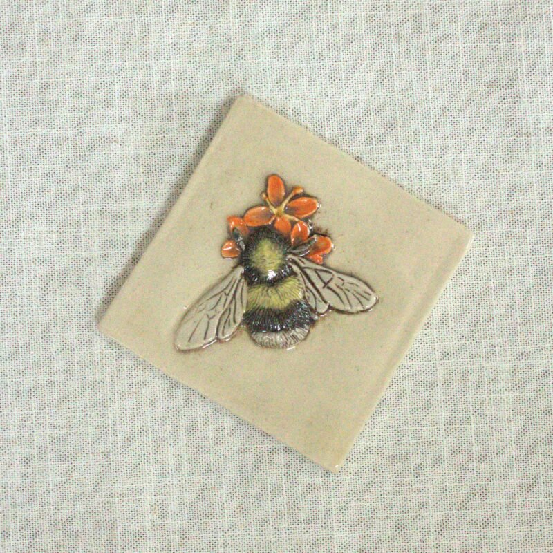 Bumblebee sitting an orange wildflower. 4 inch tile