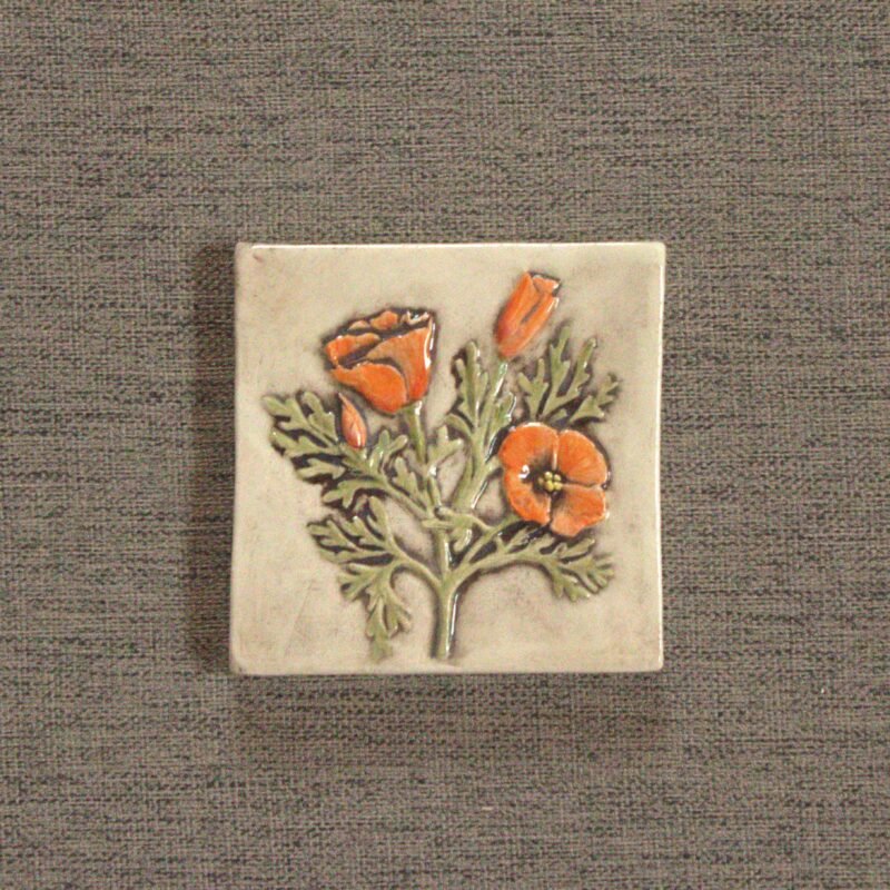 4 inch ceramic tile with hand carved orange poppy flowers.