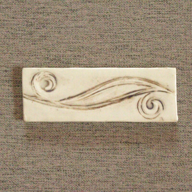 photograph showing 2x6 inch meadow breeze hand carved tile