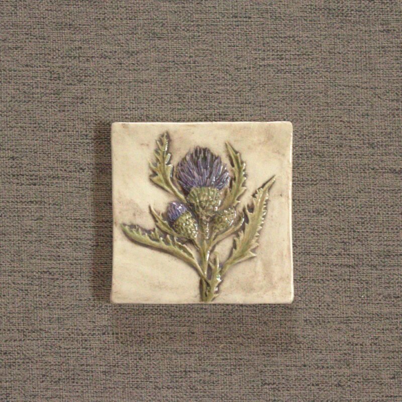 Purple thistle flower on a hand carved and hand painted ceramic art tile